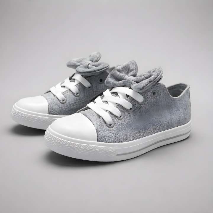 Graue, vielseitige Kindersneaker mit abnehmbarer Schleife