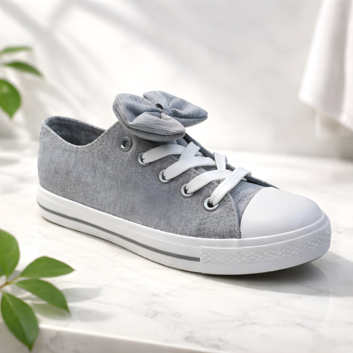 Graue, vielseitige Kindersneaker mit abnehmbarer Schleife